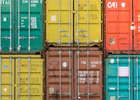 Vibrant cargo containers stacked in a shipping yard highlighting global trade.